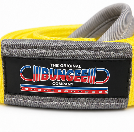 Yellow and gray tow strap with black rectangular brand tag