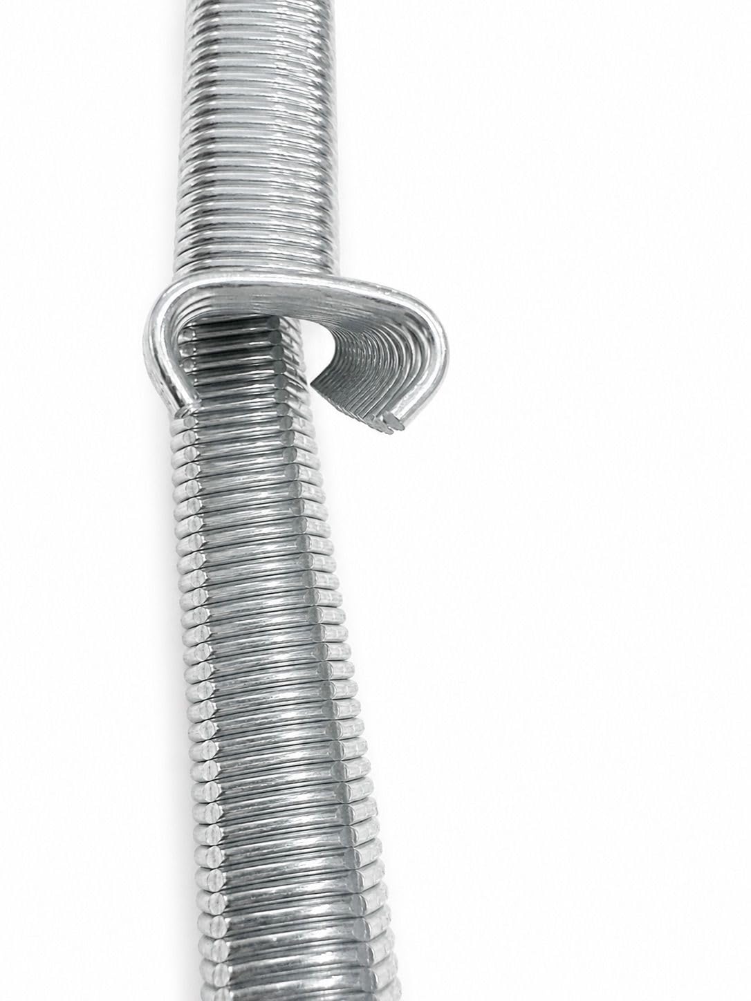 Close-up of silver C-ring staples with stacked coils