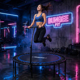 Woman using a Bungee Fit fitness trampoline in a neon-lit studio.