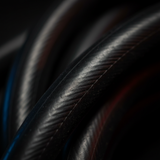 Close-up of dark rubber elastic cord with smooth, ridged surface