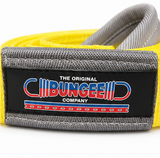 Yellow and gray tow strap with black rectangular brand tag