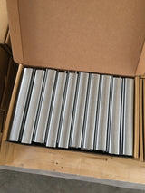Metal hog rings in a box, neatly coiled on a spool