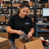 Black crewneck T-shirt on woman with embroidered chest logo