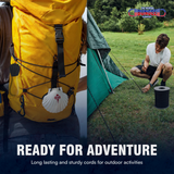 Black bungee cords securing an outdoor backpack and tent setup