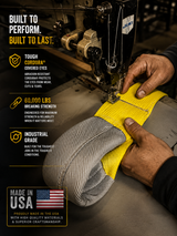 Yellow lifting strap loop with denim-gray cover and stamped strength labels