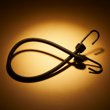Black heavy-duty bungee cord with hooks under amber industrial lighting