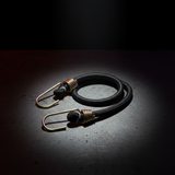 Black bungee cord assembly with gold metal hooks and coil spring ends