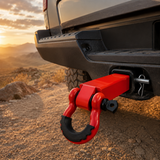 Red shackle hitch receiver installed on an off-road truck