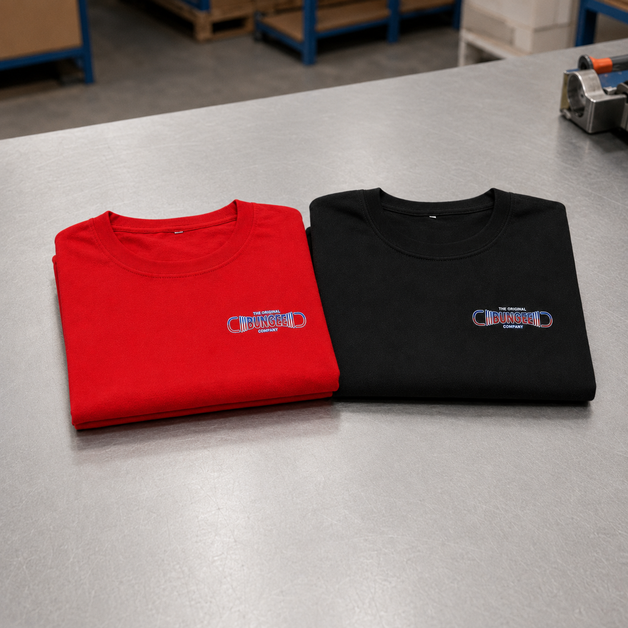 Two folded crewneck T-shirts: red and black, each with Bungee chest logo