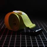 Rolled yellow winch strap with black flat hook end, heavy-duty polyester webbing